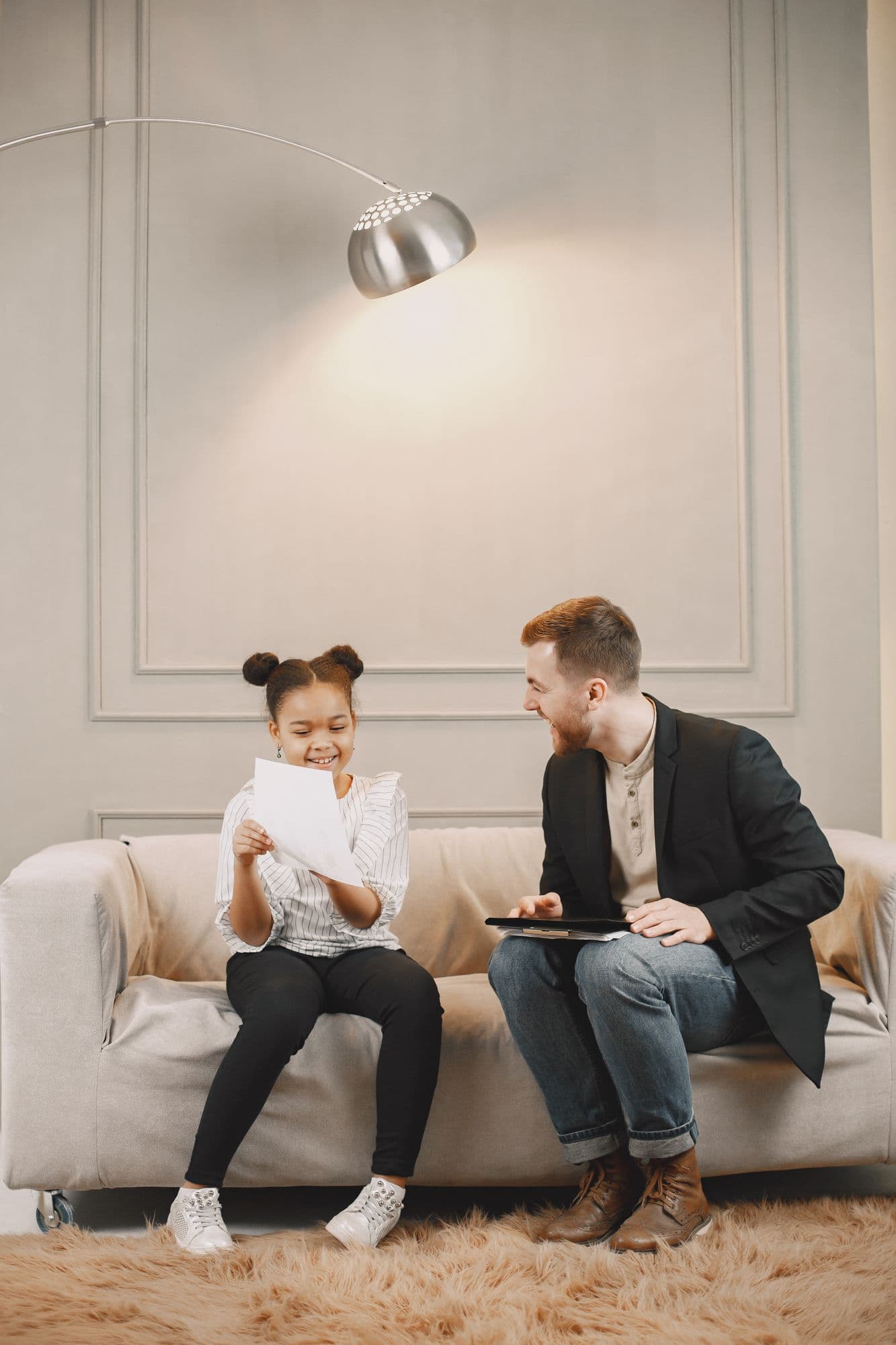 A mentor sharing a warm, encouraging moment with a young child