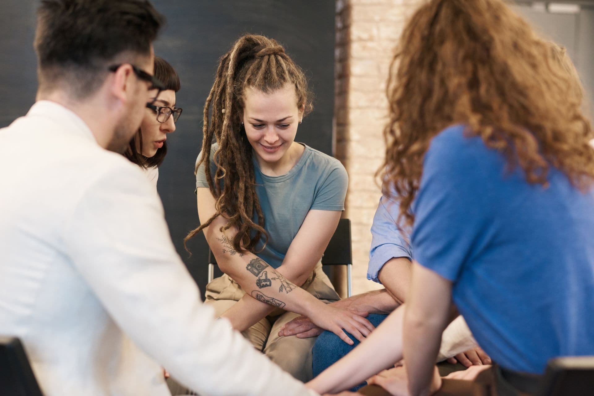 A warm, supportive group session — clinician and clients connecting